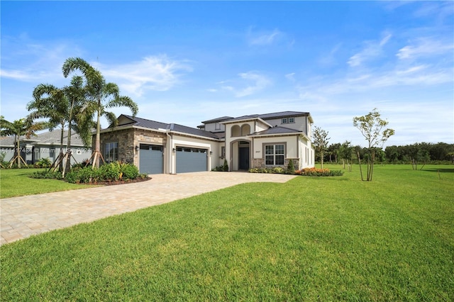 view of front of house with a front lawn and a garage