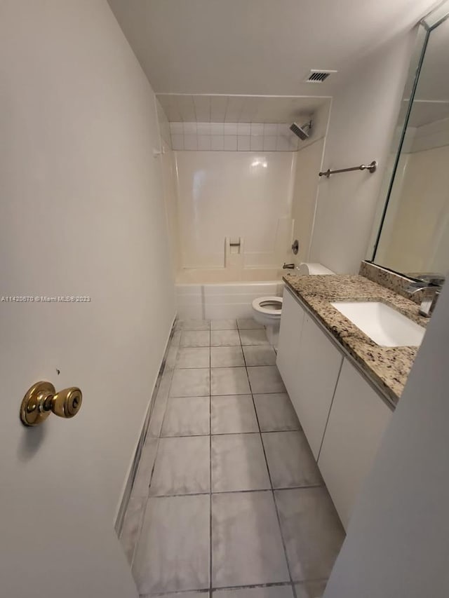 full bathroom with vanity, toilet, tile floors, and tub / shower combination