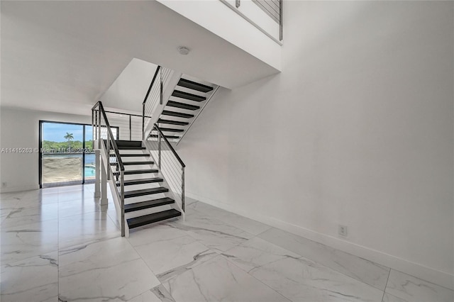 staircase with light tile floors