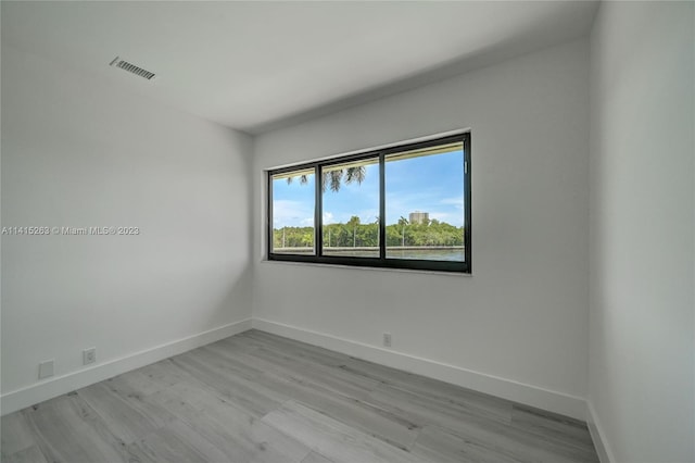 unfurnished room featuring light hardwood / wood-style flooring