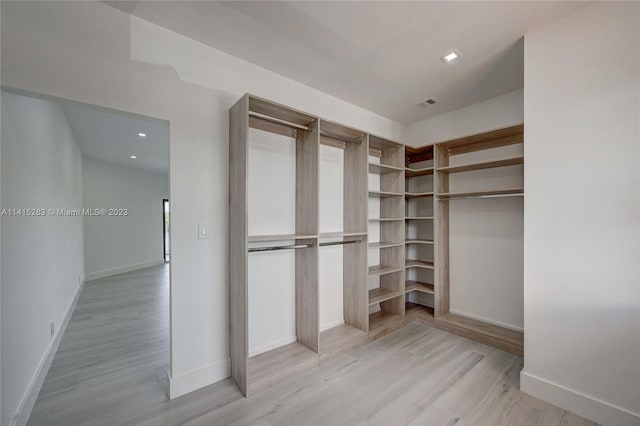 walk in closet featuring light wood-type flooring