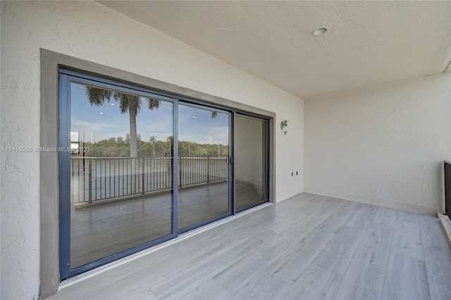 exterior space with light hardwood / wood-style floors