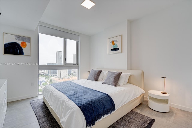 bedroom featuring light tile flooring