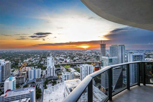 view of balcony at dusk