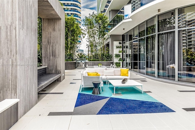 view of patio with a balcony and outdoor lounge area