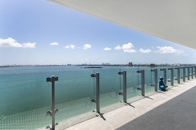 balcony featuring a water view