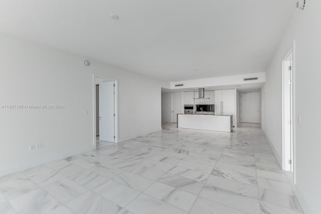 unfurnished living room featuring light tile patterned floors