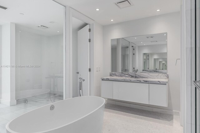 bathroom featuring vanity and a bathing tub