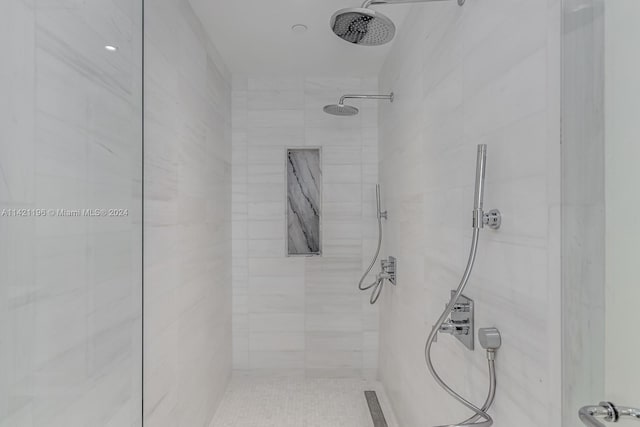 bathroom with tiled shower