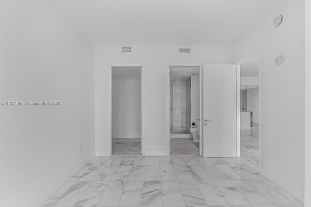 empty room with light tile patterned flooring