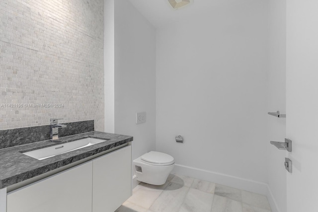 bathroom with tile patterned floors, vanity, and toilet