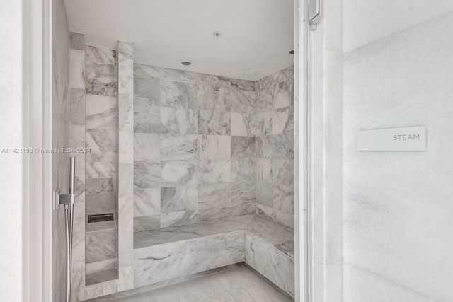 bathroom featuring a tile shower