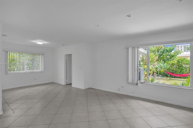 spare room with light tile flooring