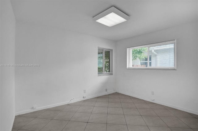 spare room featuring light tile floors