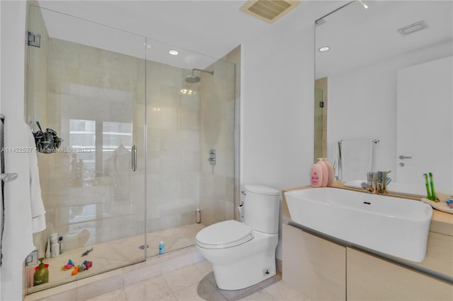 bathroom featuring tile flooring, an enclosed shower, and toilet