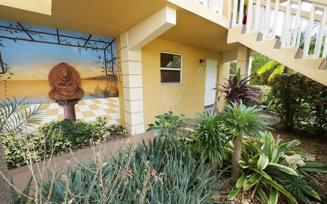 entrance to property with a balcony