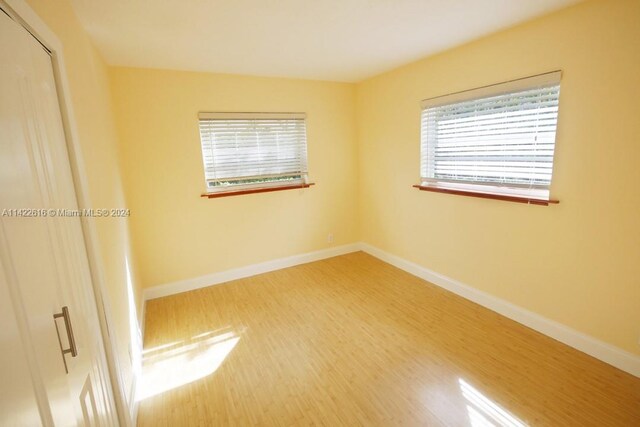 unfurnished room featuring light wood-type flooring