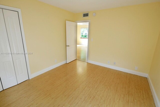 empty room with light hardwood / wood-style floors