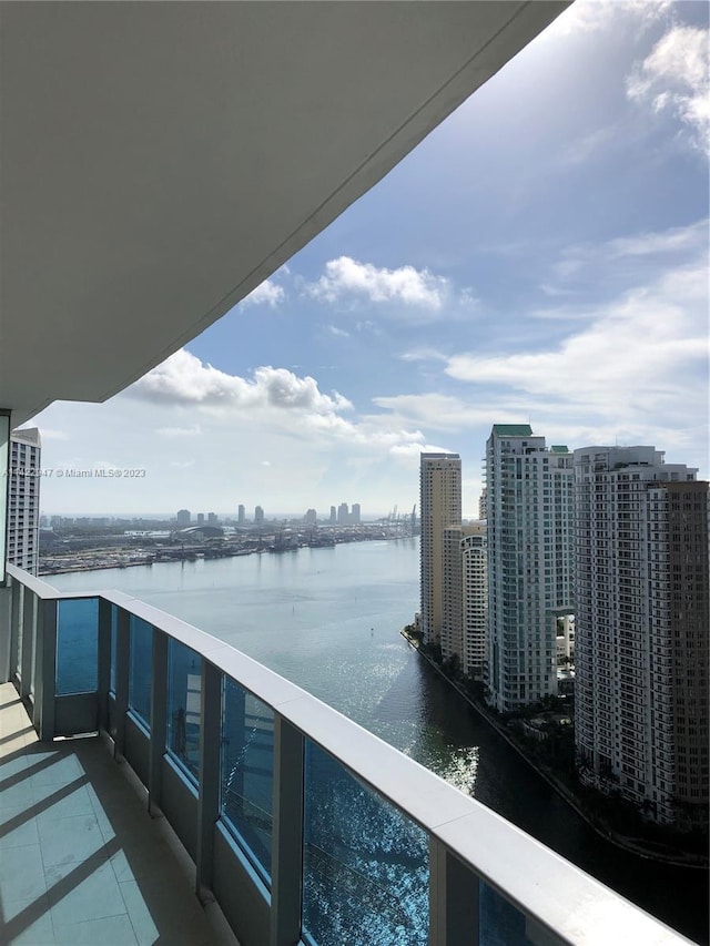 balcony featuring a water view