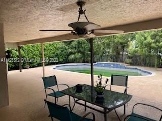 exterior space featuring ceiling fan and a patio area