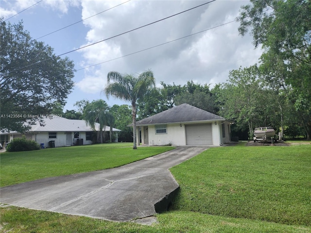 ranch-style house with a garage and a front lawn