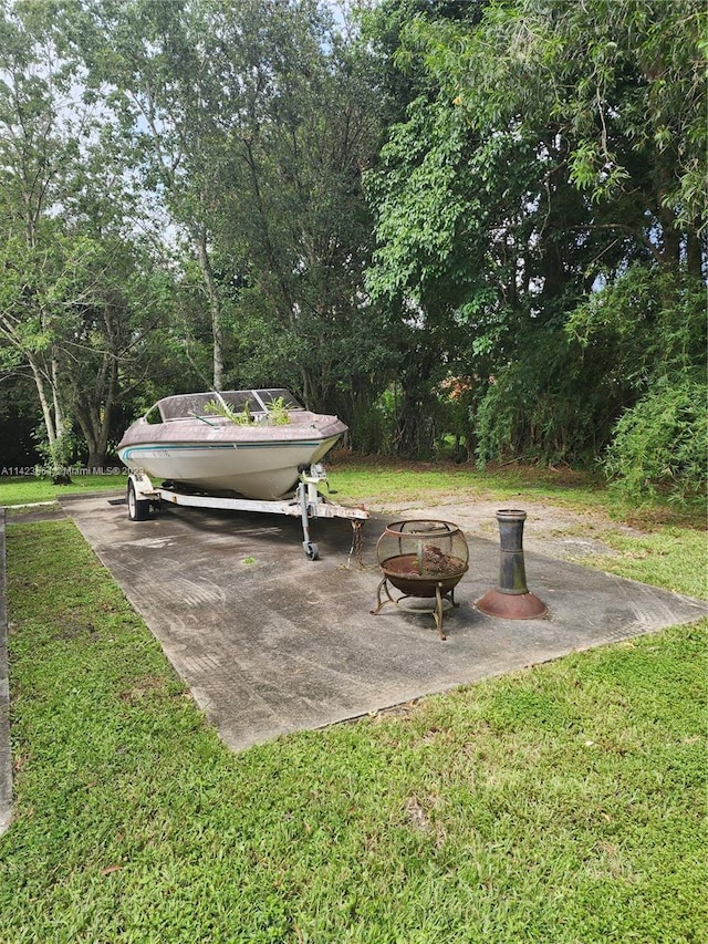 view of yard with a fire pit