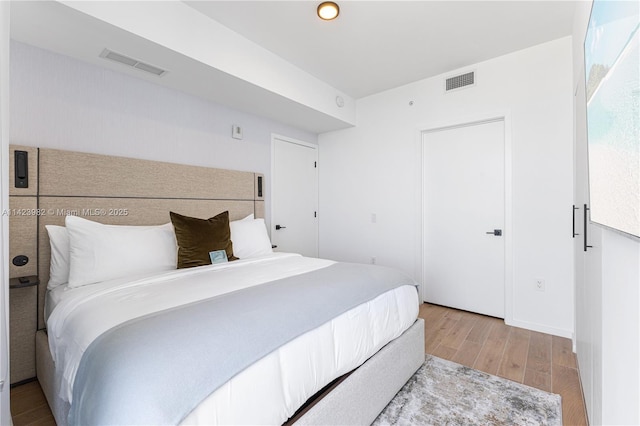 bedroom with light hardwood / wood-style floors