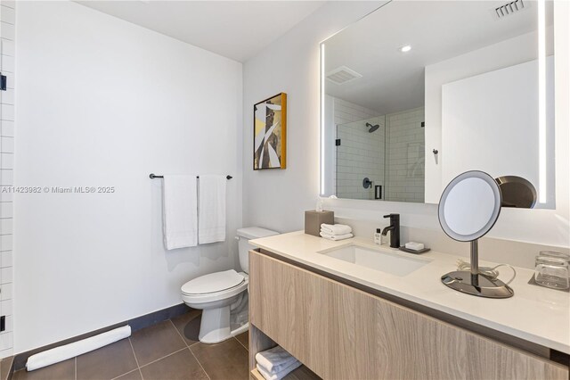 bathroom with walk in shower, tile patterned floors, toilet, and vanity