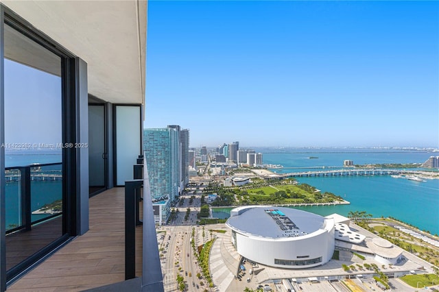 balcony featuring a water view