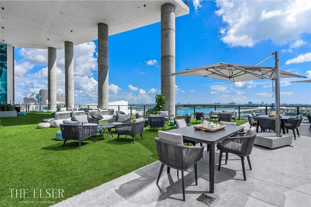 view of patio / terrace with a water view and an outdoor hangout area