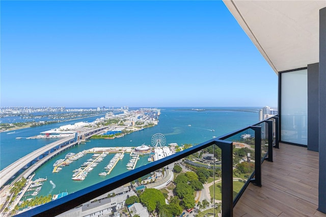 balcony featuring a water view