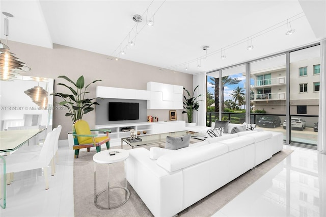 living room with light tile patterned floors and track lighting