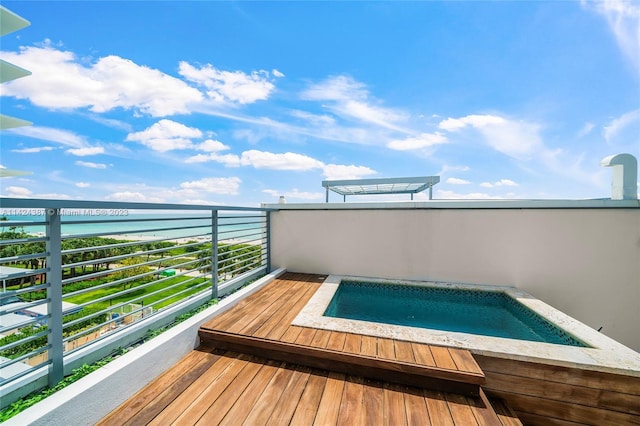 view of swimming pool featuring an outdoor hot tub