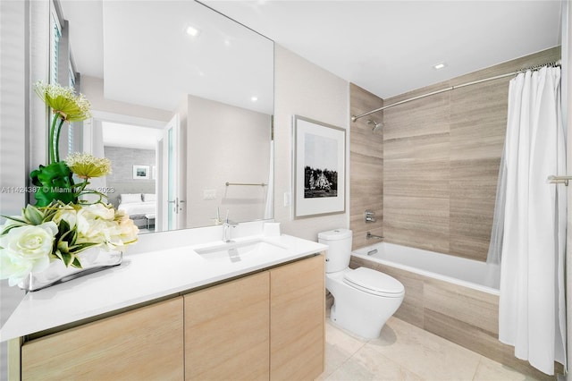 full bathroom with tile patterned floors, shower / bath combo, toilet, and vanity