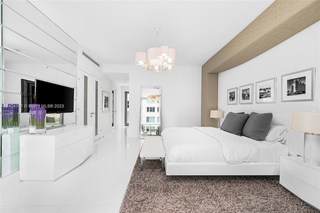 bedroom featuring a chandelier