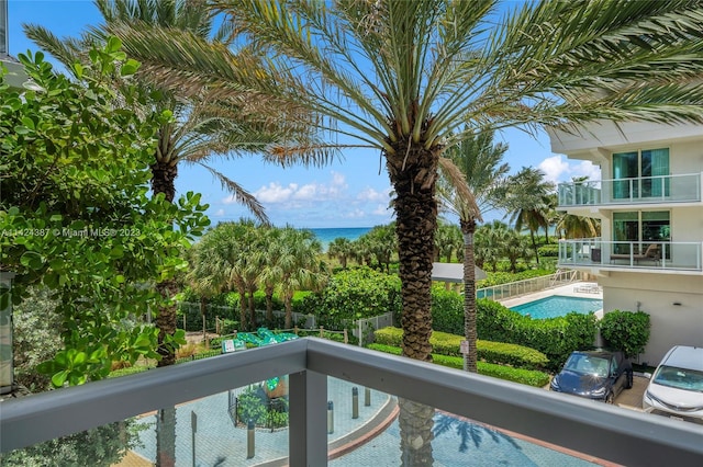 view of pool with a water view