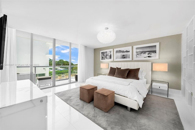 bedroom featuring light tile patterned floors, a wall of windows, and access to outside