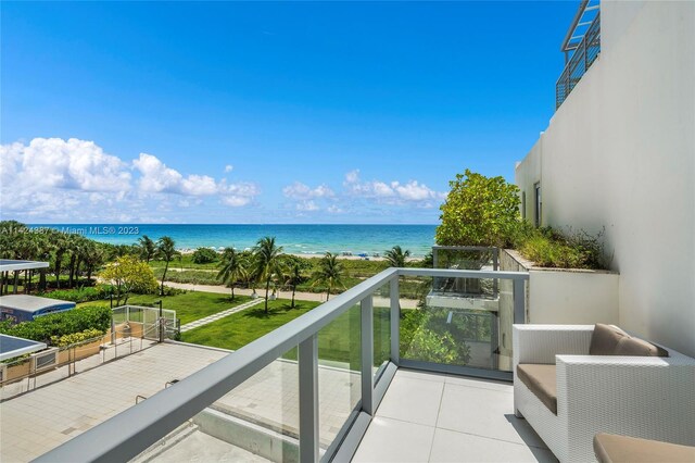 balcony featuring a water view