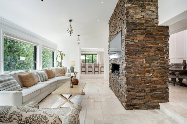 living room featuring light tile patterned floors and a stone fireplace