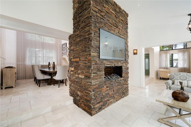 tiled living room with a towering ceiling