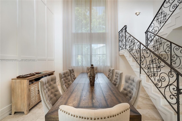 dining space featuring light tile patterned flooring