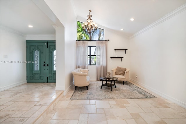 tiled foyer featuring a chandelier, lofted ceiling, and ornamental molding