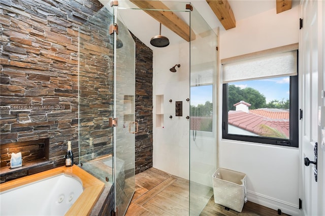 bathroom featuring shower with separate bathtub and vaulted ceiling with beams