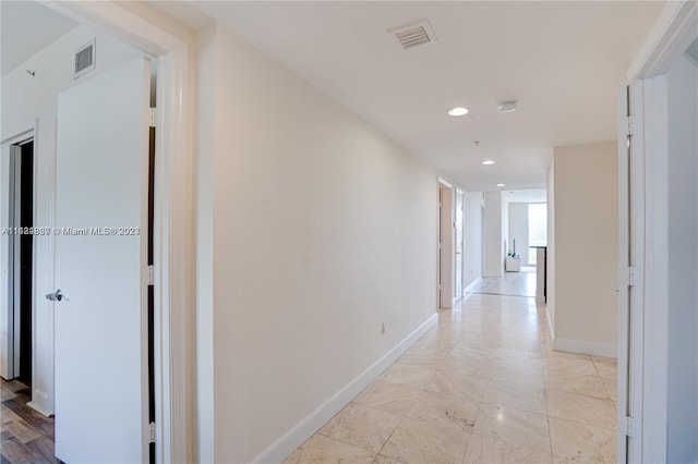 hallway with light tile floors