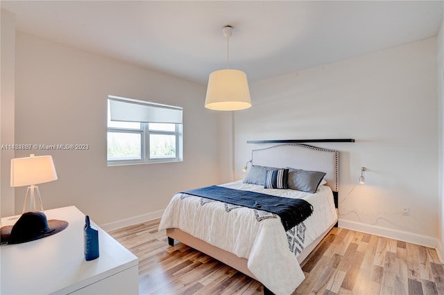 bedroom featuring light wood-type flooring