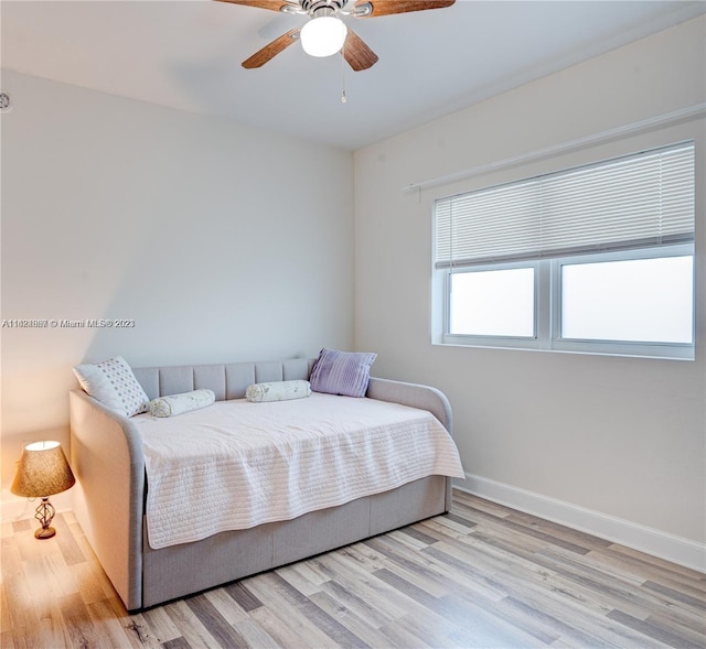 bedroom featuring light hardwood / wood-style flooring and ceiling fan