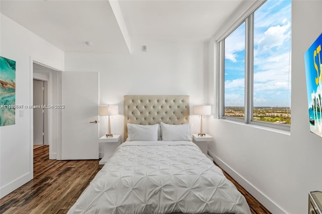 bedroom featuring dark wood-type flooring