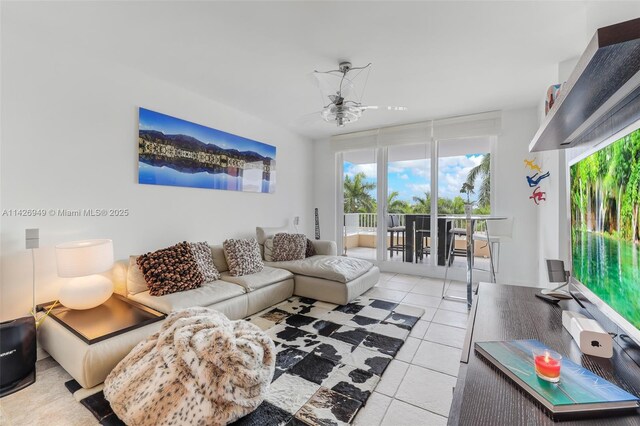 tiled living room with ceiling fan