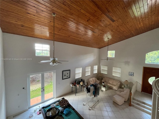 living room featuring high vaulted ceiling, wood ceiling, ceiling fan, and light tile floors