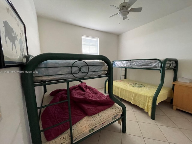 bedroom featuring ceiling fan and light tile floors